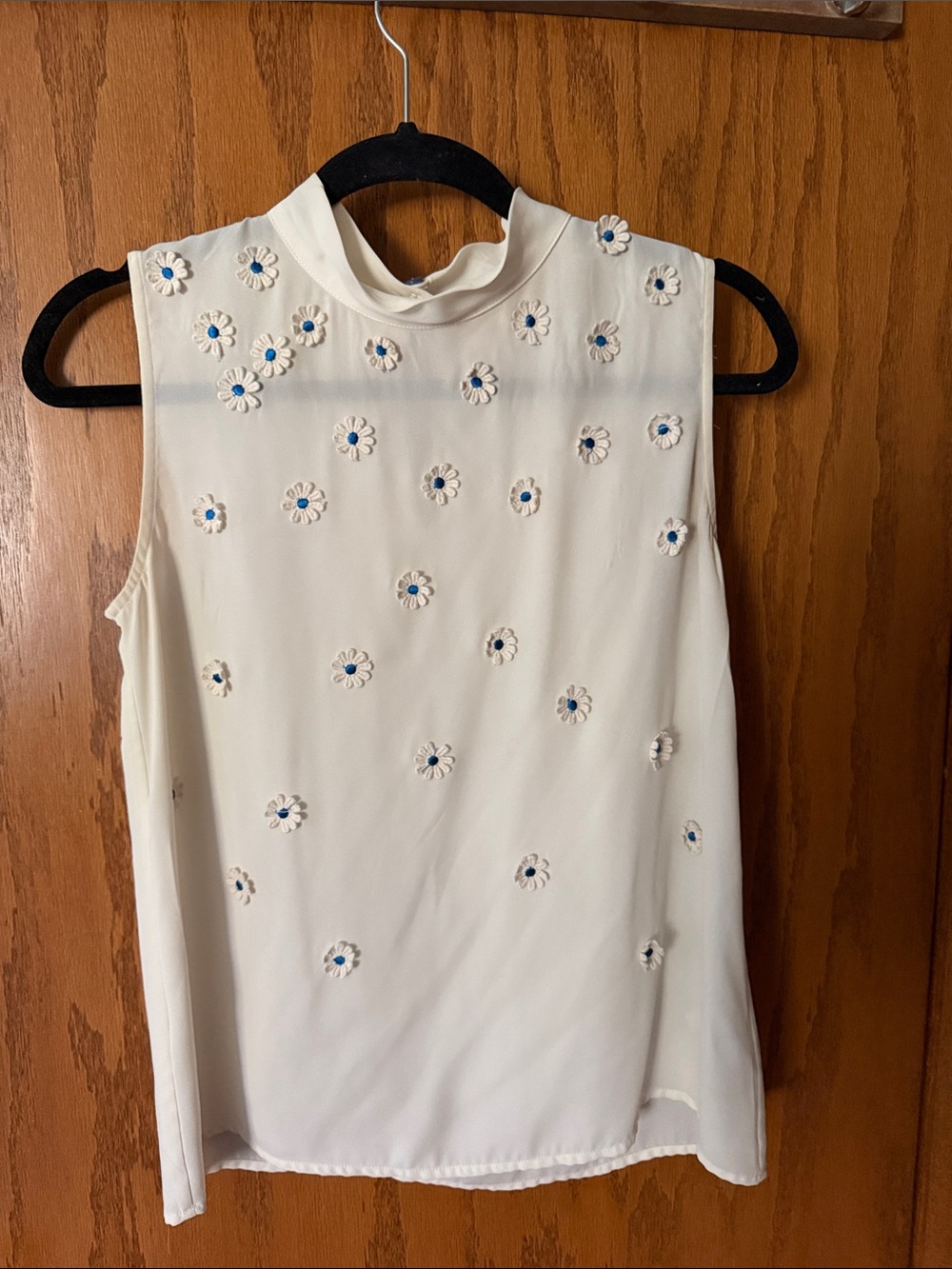 Sleeveless Cream Mock Neck Top with Daisy Embellishments